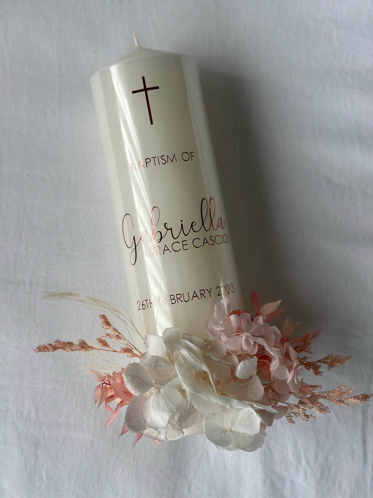 Elegant christening candle with dried floral arrangement