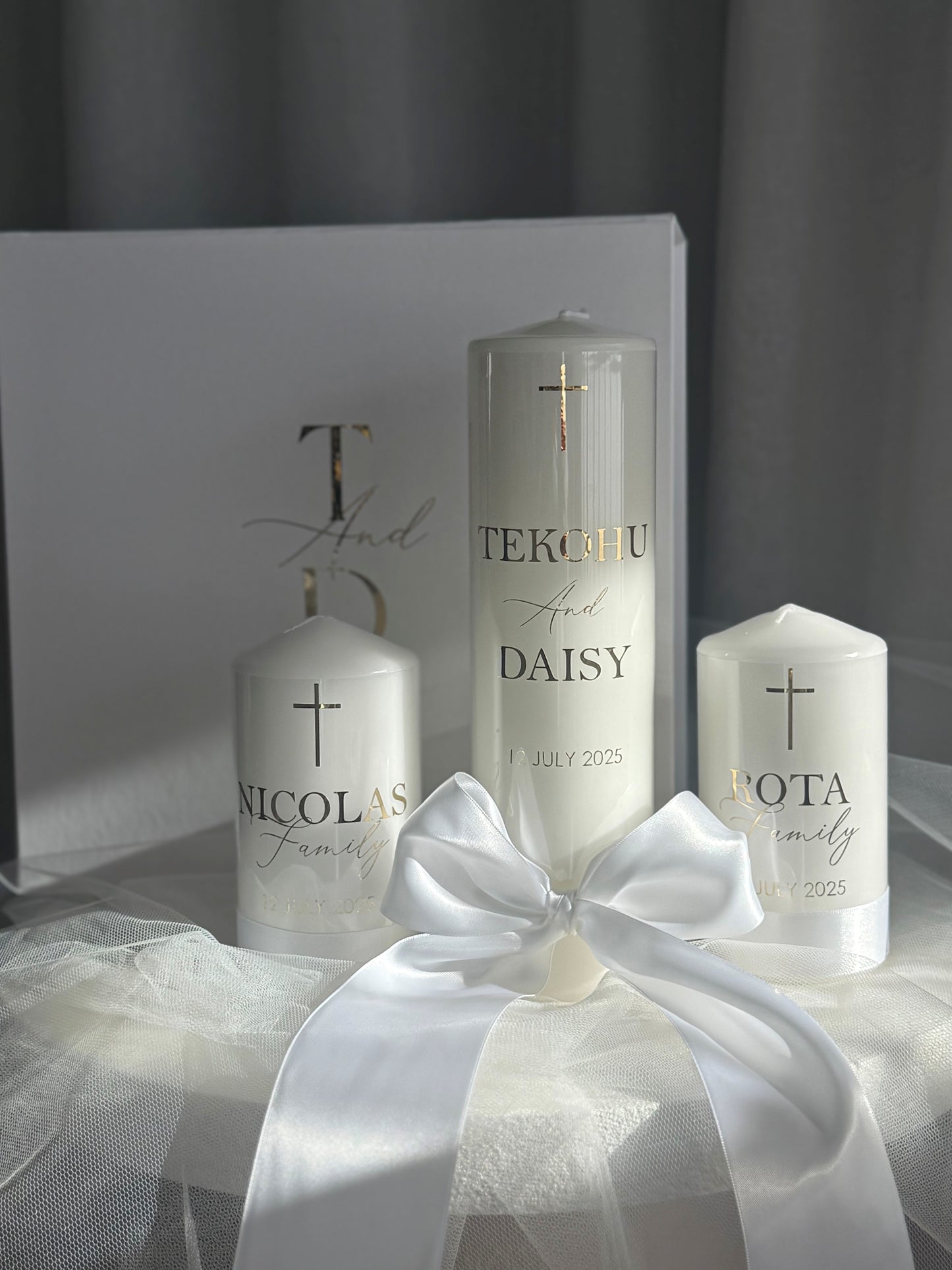 White satin wedding unity candle set displayed for ceremony, including 1 bridal and 2 family candles, personalised keepsake for weddings and vow renewals