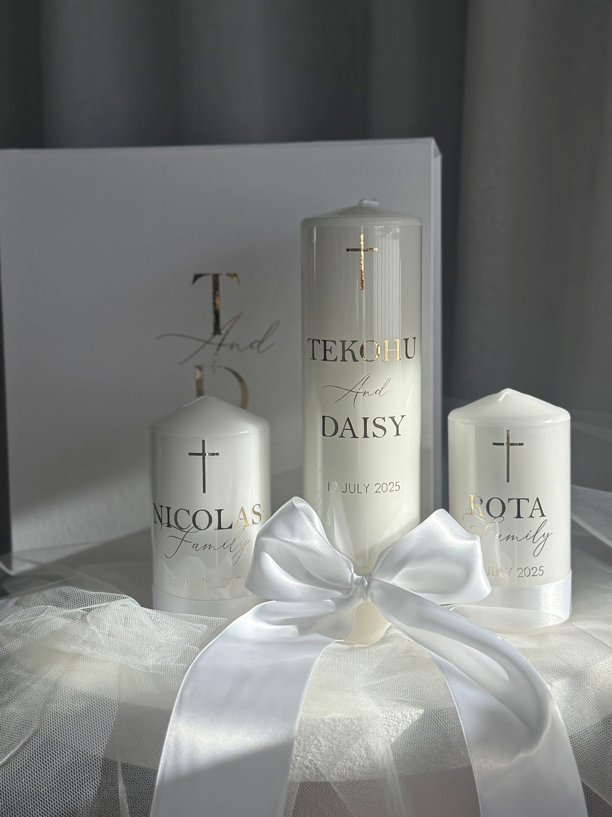 White satin wedding unity candle set displayed for ceremony, including 1 bridal and 2 family candles, personalised keepsake for weddings and vow renewals